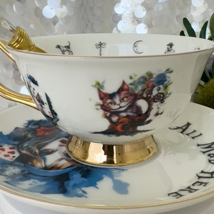 Alice in Wonderland Tea cup and saucer set. Punk style Alice. Learn tea leaf reading the easy way. FREE online course.