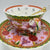Video of the tasseography teacup set, rotating to show the colourful external floral design and the internal fortune symbols.