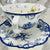 Close-up of the intricate blue bird design on the tea cup and matching saucer
