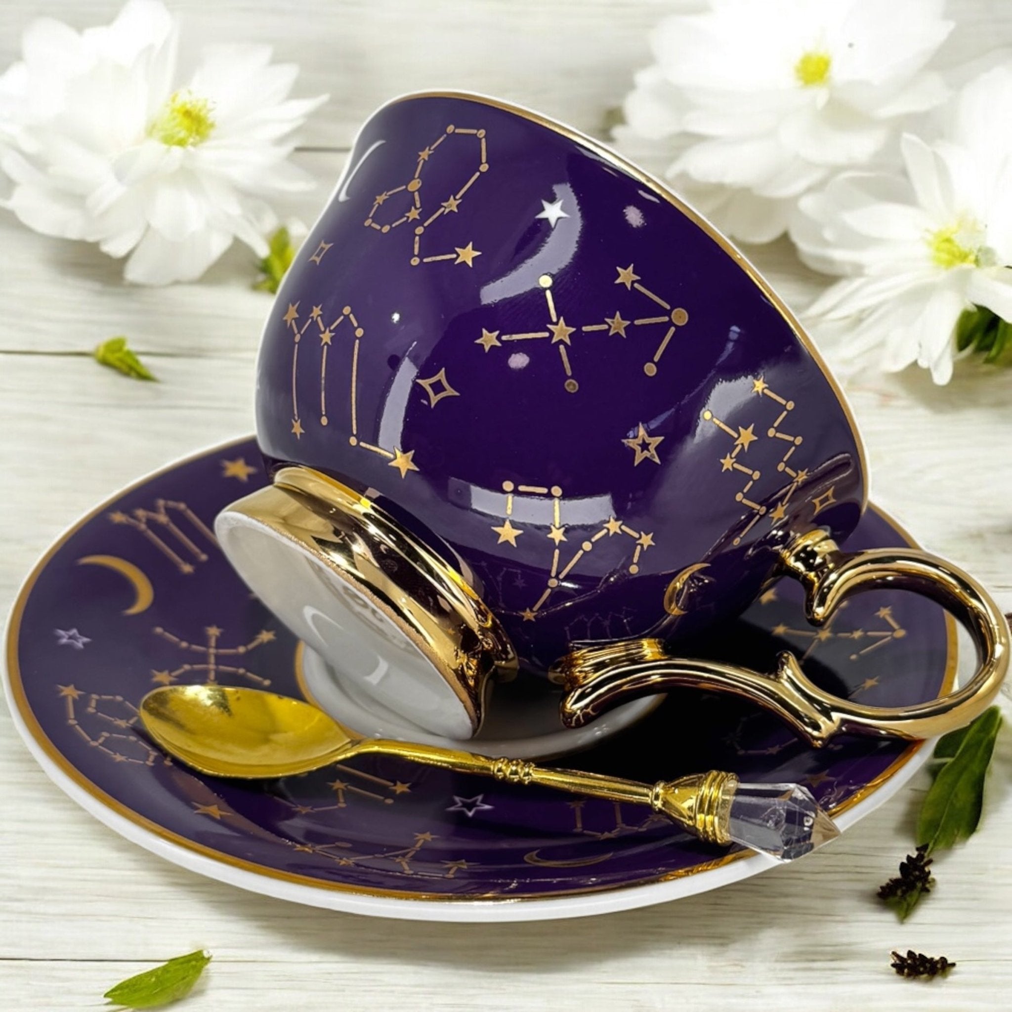 Luxury gold-accented teacup with permanent symbols inside, perfect for tea leaf reading and divination, curated by Karin in her home studio."