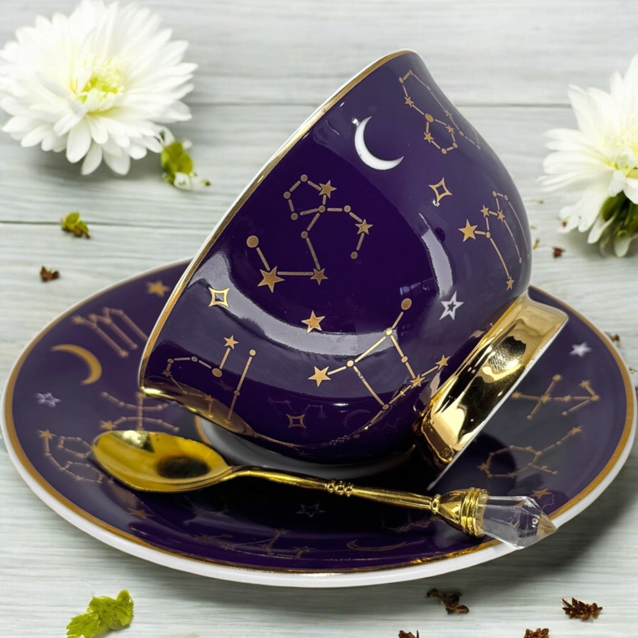 Luxury gold-accented teacup with permanent symbols inside, perfect for tea leaf reading and divination, curated by Karin in her home studio."