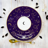 Luxury gold-accented teacup with permanent symbols inside, perfect for tea leaf reading and divination, curated by Karin in her home studio."