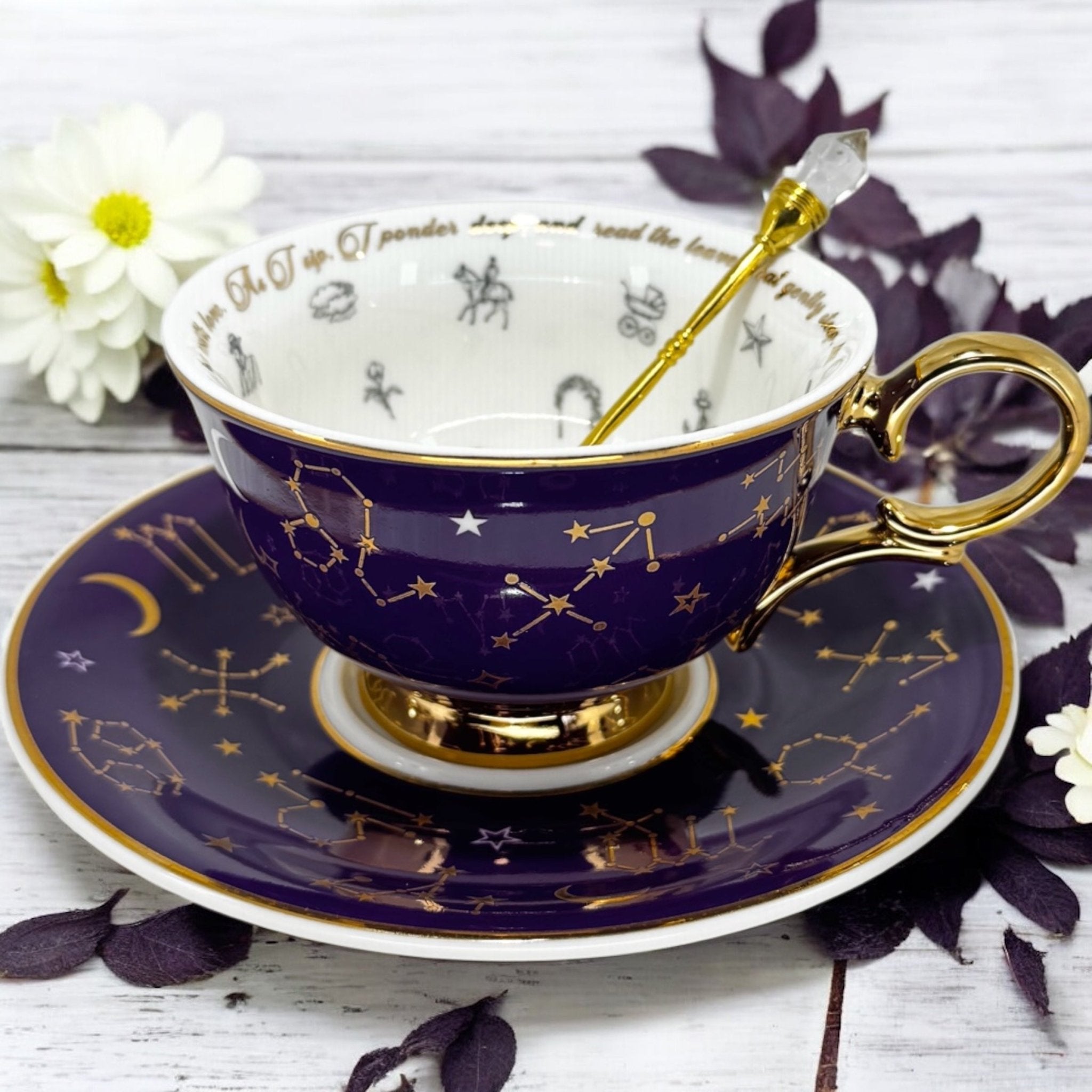 Luxury gold-accented teacup with permanent symbols inside, perfect for tea leaf reading and divination, curated by Karin in her home studio."