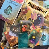 A beautiful 52-card tea leaf reading deck with vibrant watercolor-style illustrations, displayed alongside a soft cotton drawstring bag and a small gold teaspoon. 