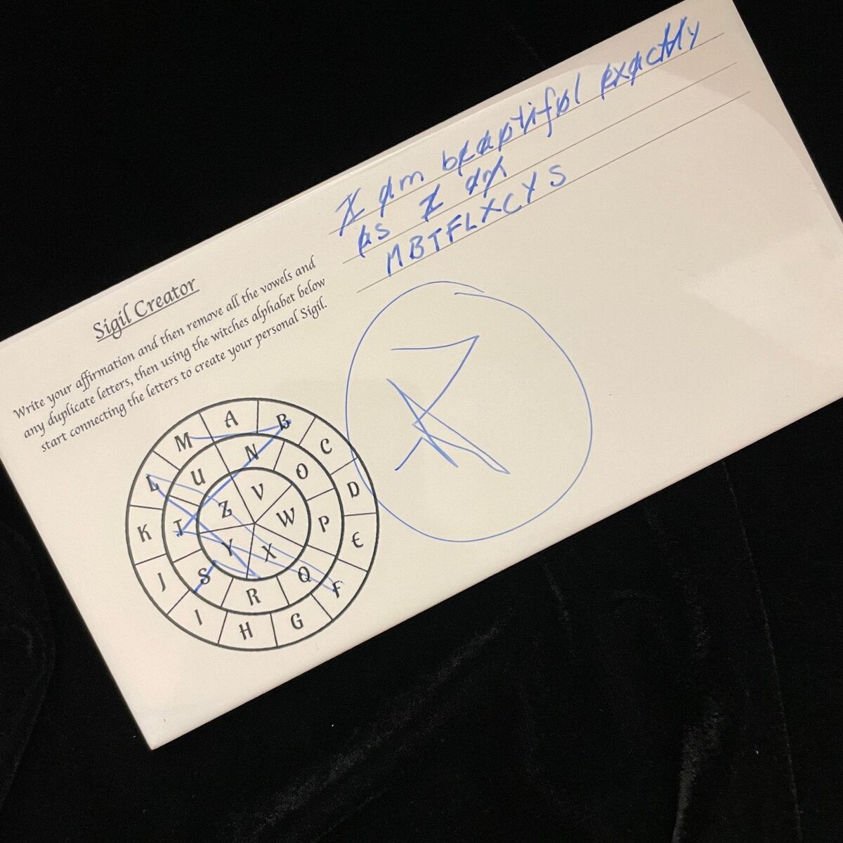 Ceramic Sigil Creator with alphabet and sigil grid, close-up view