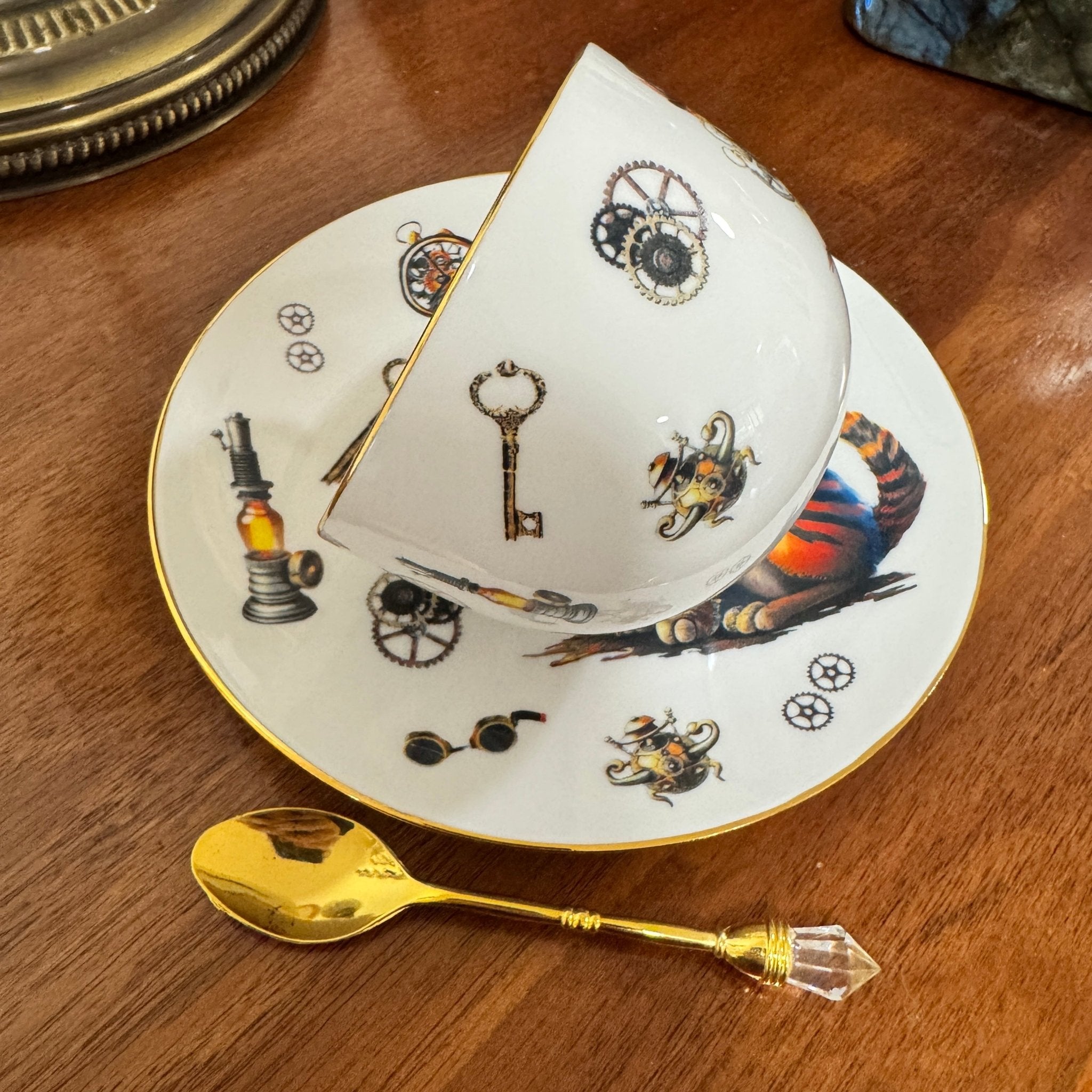 Centre view of steampunk cat teacup with cogs and keys