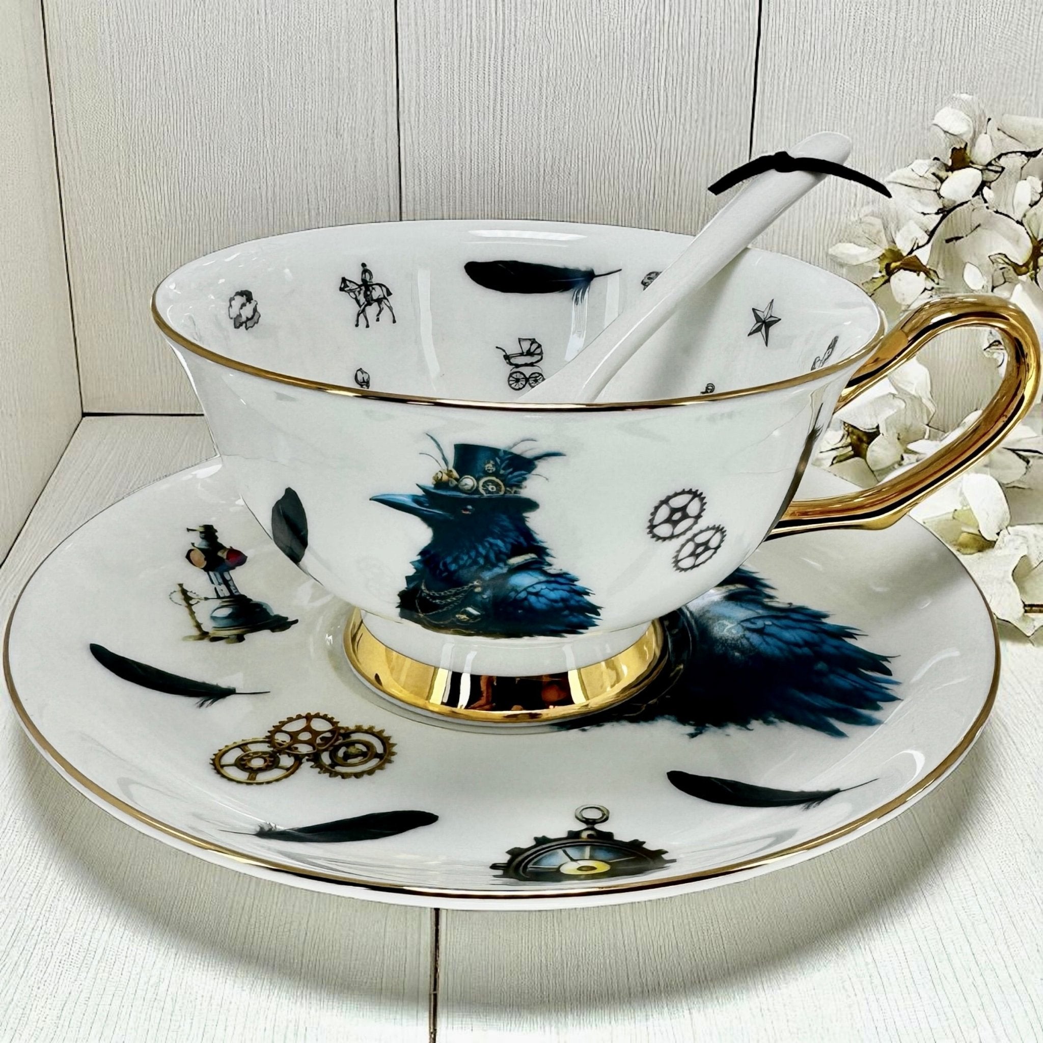 Raven Teacup and saucer set with decorative design on a white surface