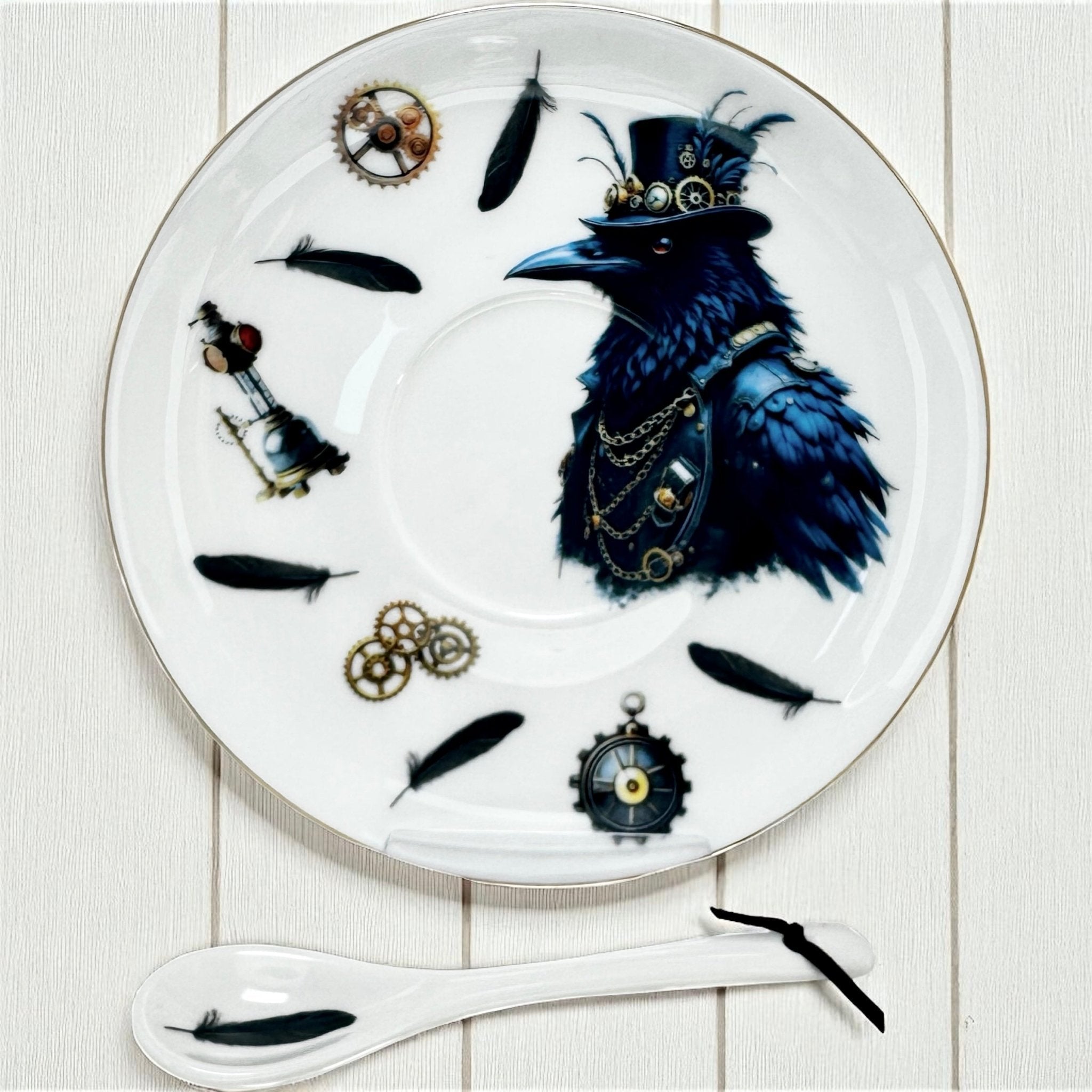 Decorative saucer with a raven wearing a top hat and goggles, surrounded by feathers and small mechanical components on a white background.