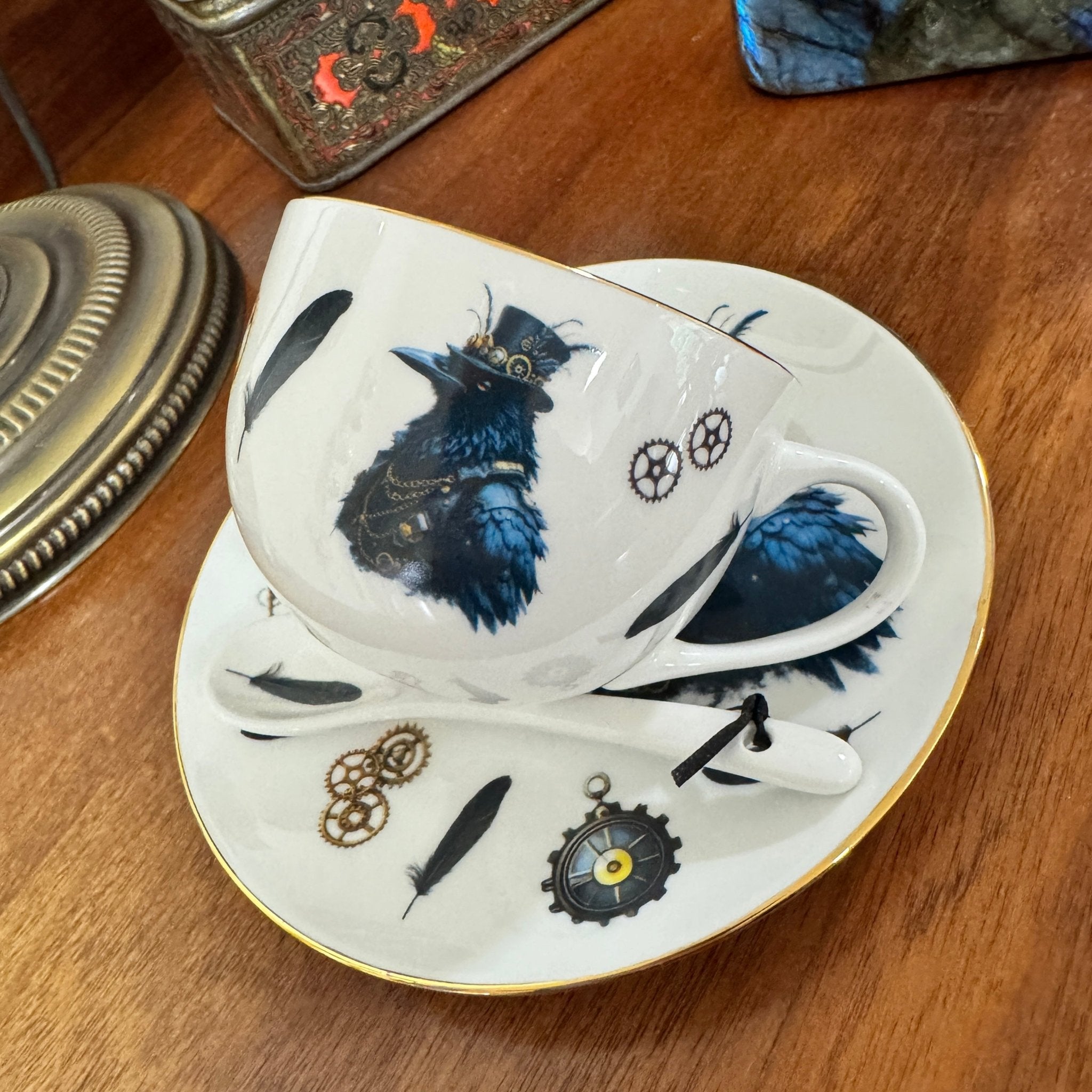 Ceramic cup and saucer set with decorative design on a wooden surface