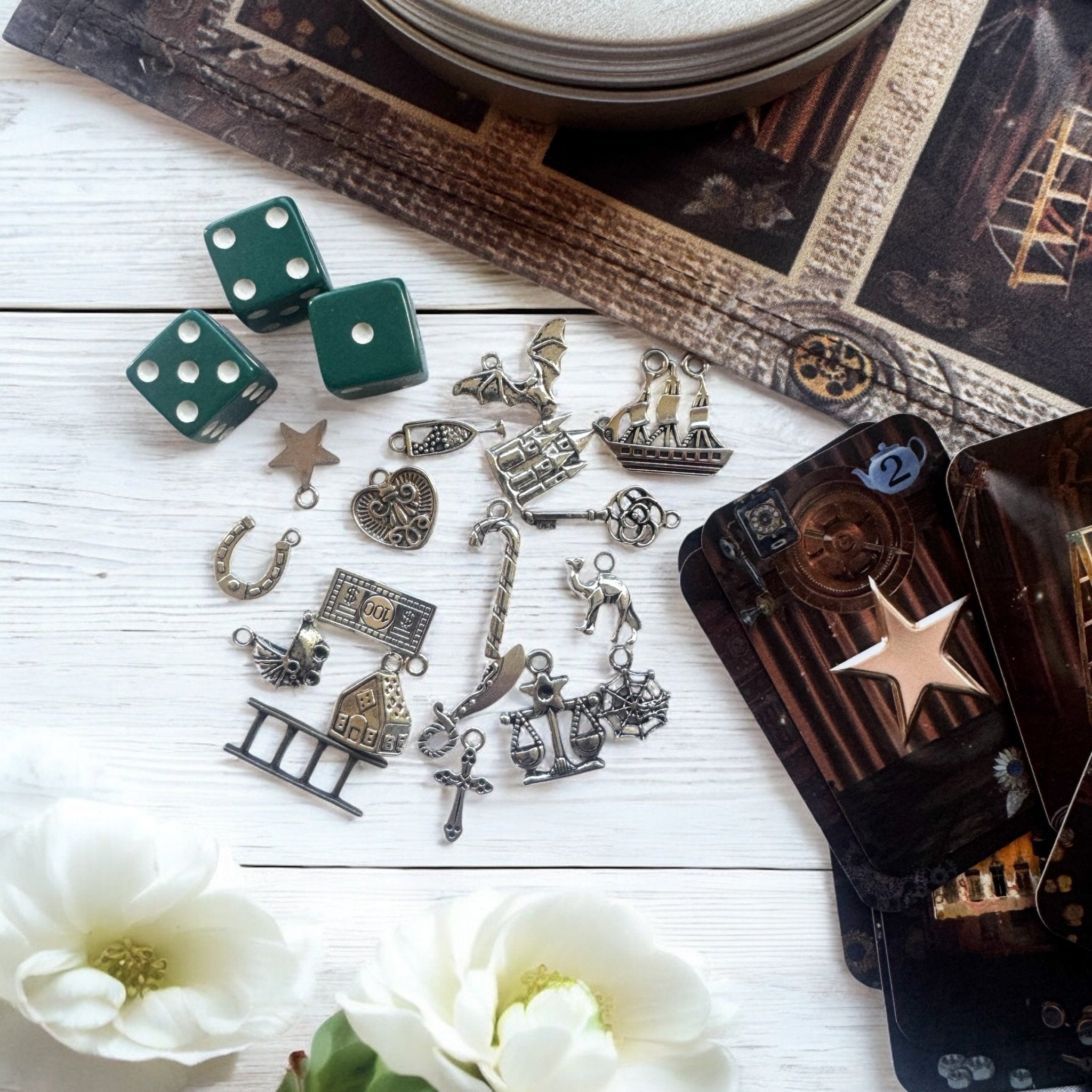 Set of 18 high-quality mini oracle-style cards with matching charms, stored in a gold tin, designed for direct questions and quick answers, perfect for portable divination and tea leaf reading.