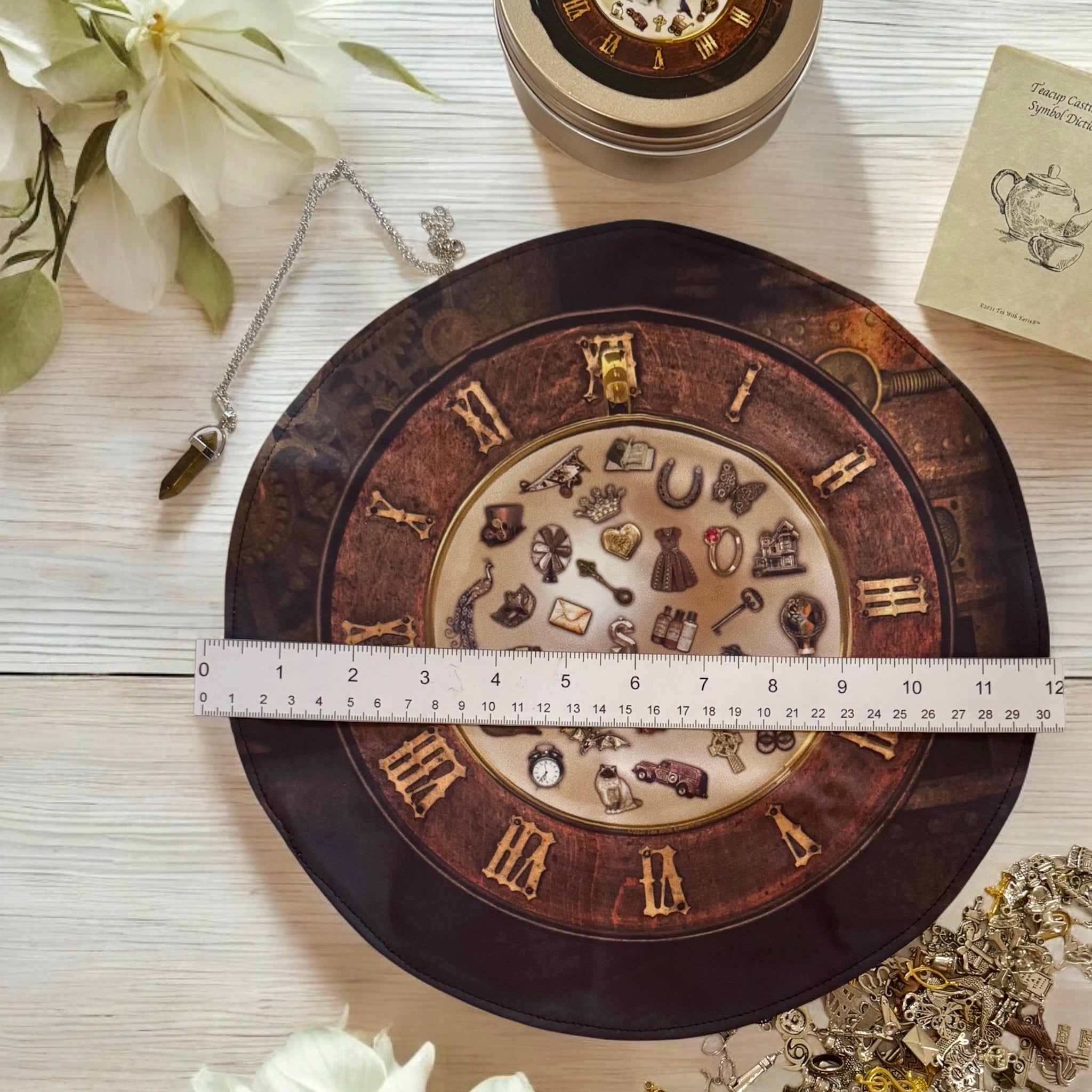 Reversible teacup mat for charm casting.  Washable spandex. Includes tigers eye pendulum and guidebook.