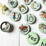 Set of 1-inch tarot buttons featuring the Major Arcana images on a pale mint green background, protected by a clear plastic coating, ideal for tarot, charm casting, and discreet divination in everyday settings