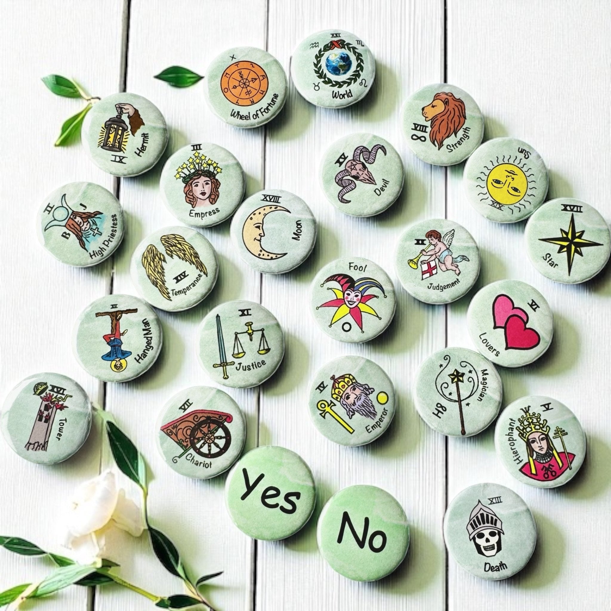 Set of 1-inch tarot buttons featuring the Major Arcana images on a pale mint green background, protected by a clear plastic coating, ideal for tarot, charm casting, and discreet divination in everyday settings