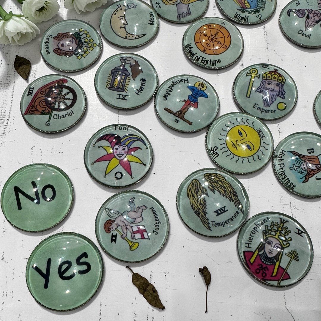 Tarot charm casting coins featuring Yes and No divination tokens alongside illustrated Major Arcana glass dome coins with smooth metal backs ideal for intuitive readings