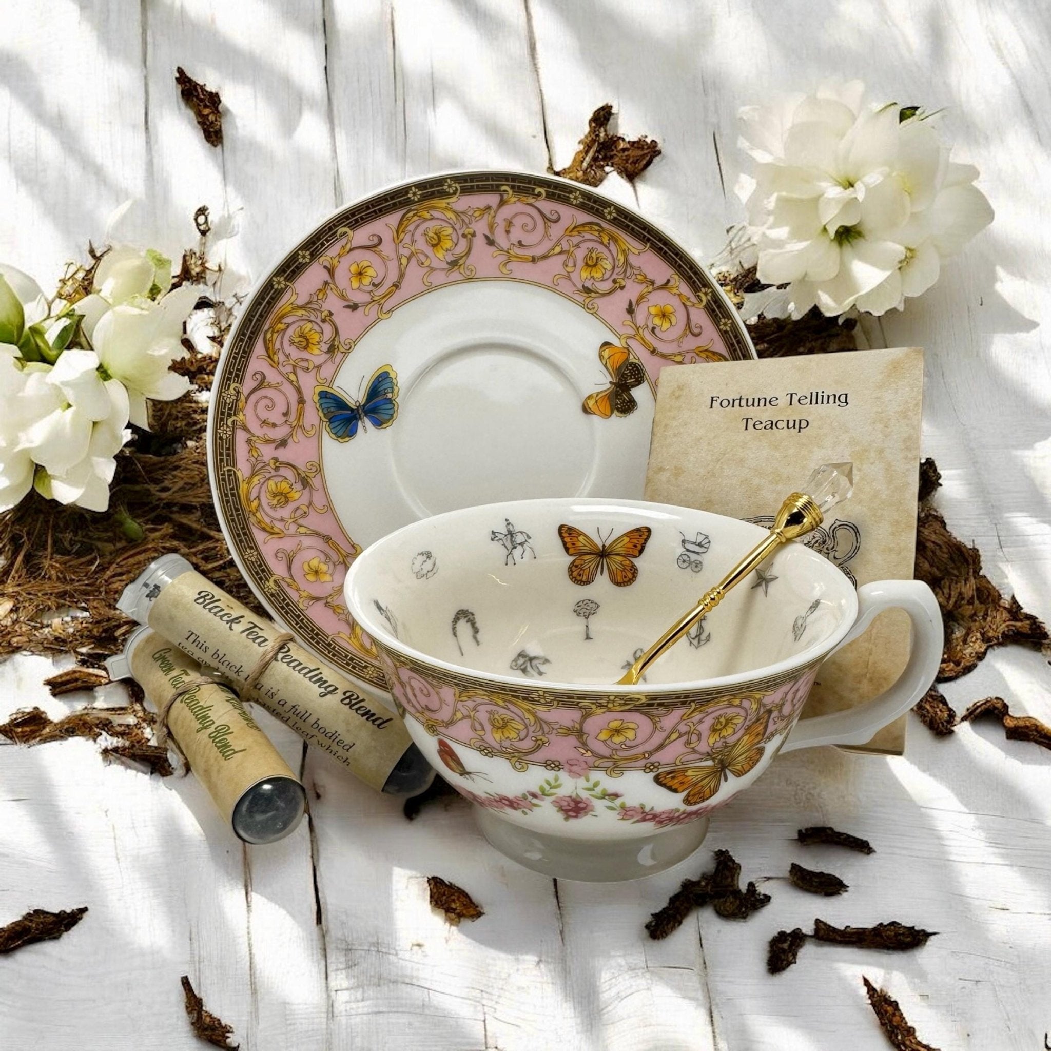 Luxury gold-accented teacup with permanent symbols inside, perfect for tea leaf reading and divination, curated by Karin in her home studio
