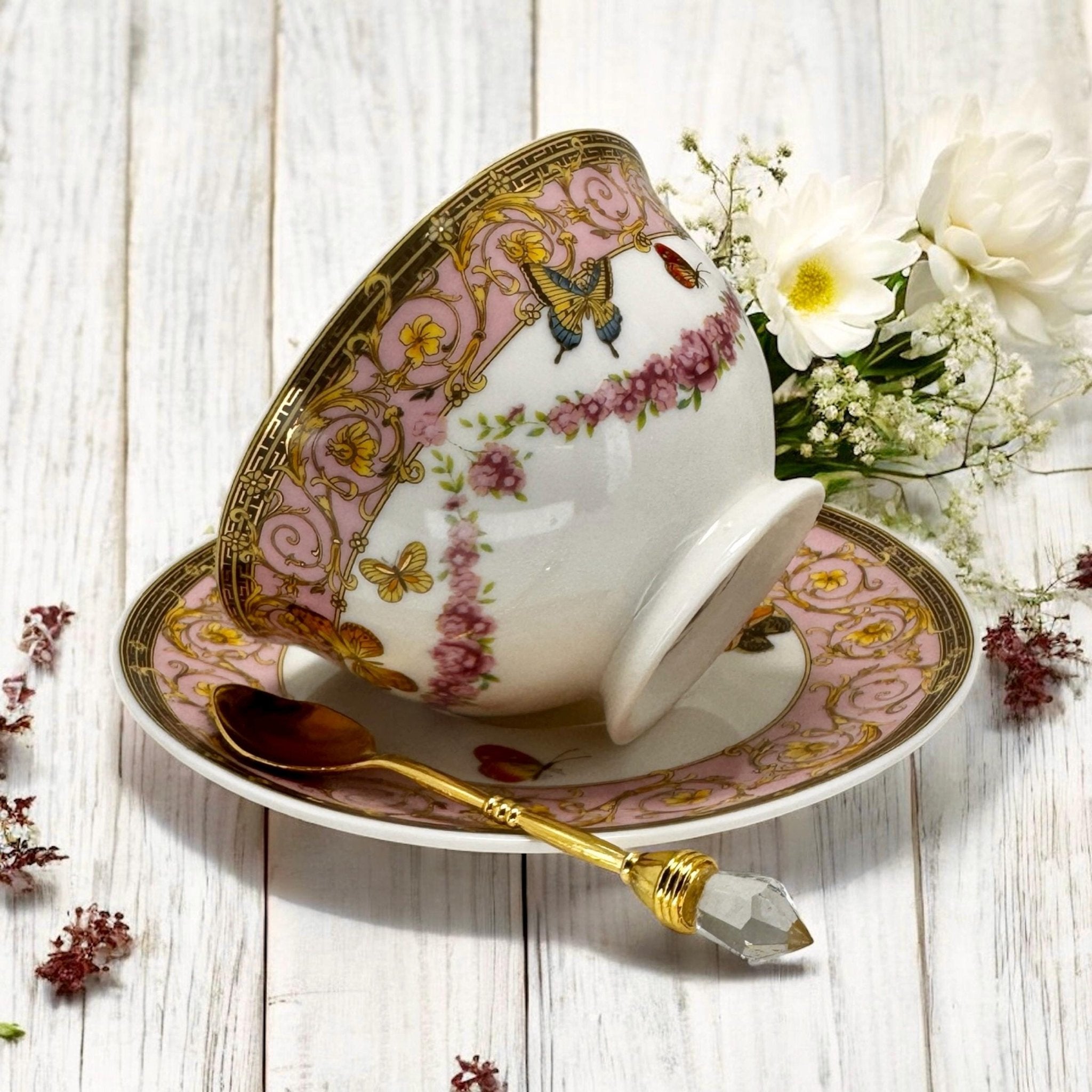 Luxury gold-accented teacup with permanent symbols inside, perfect for tea leaf reading and divination, curated by Karin in her home studio