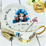 Alice in Wonderland bone china teacup with gold rim and tea leaves for divination.