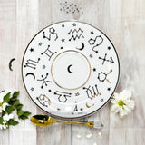 Luxury gold-accented teacup with permanent Tasseography symbols inside, including astrology symbols and a gold verse, perfect for tea leaf reading and divination.