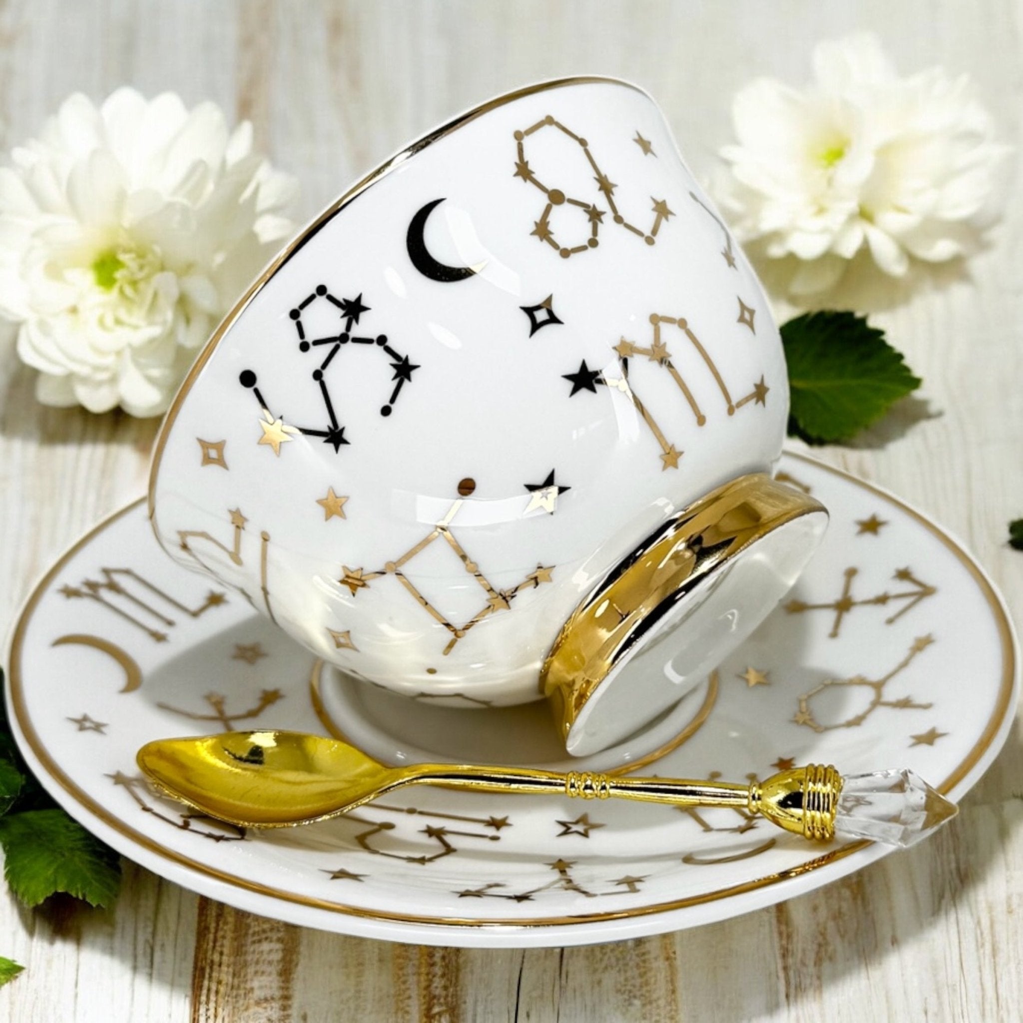 Luxury gold-accented teacup with permanent Tasseography symbols inside, including astrology symbols and a gold verse, perfect for tea leaf reading and divination.