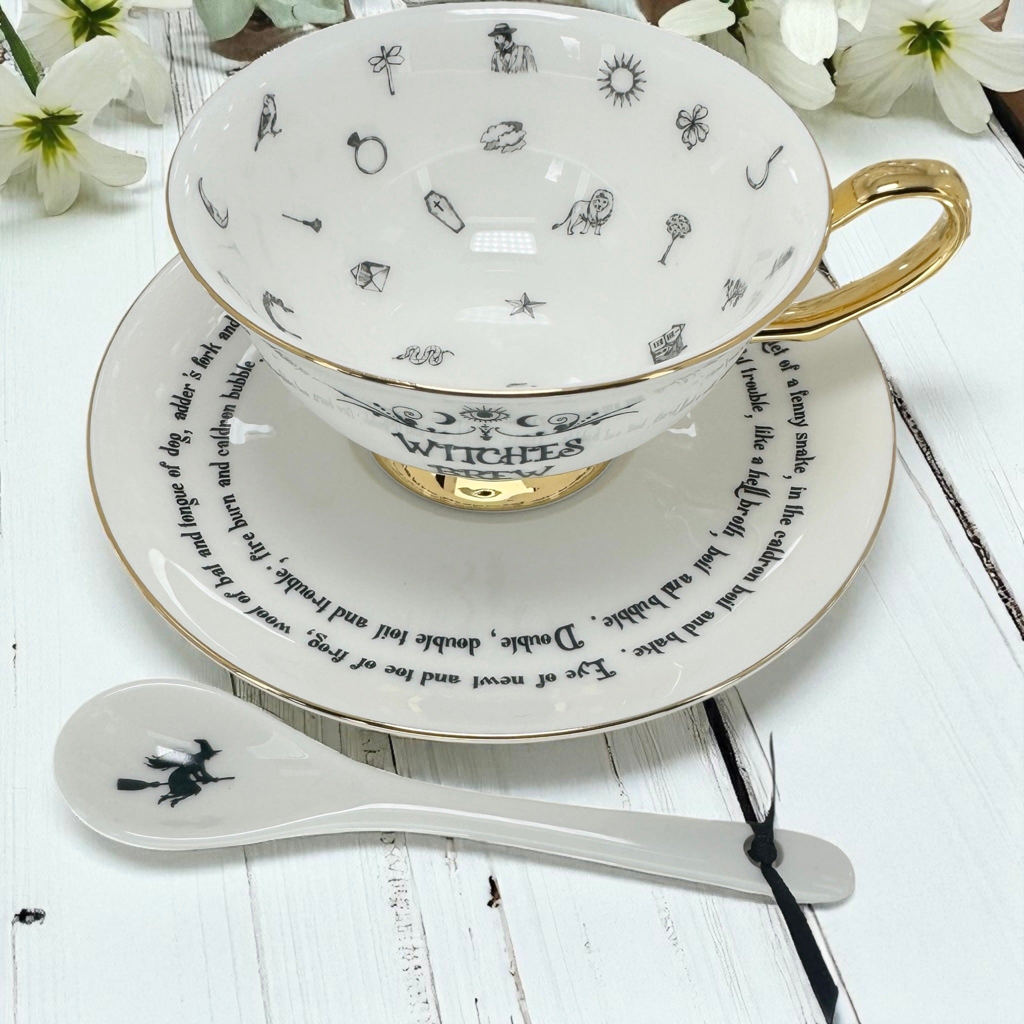 Close-up of the Tasseography teacup interior, showing the printed divination symbols