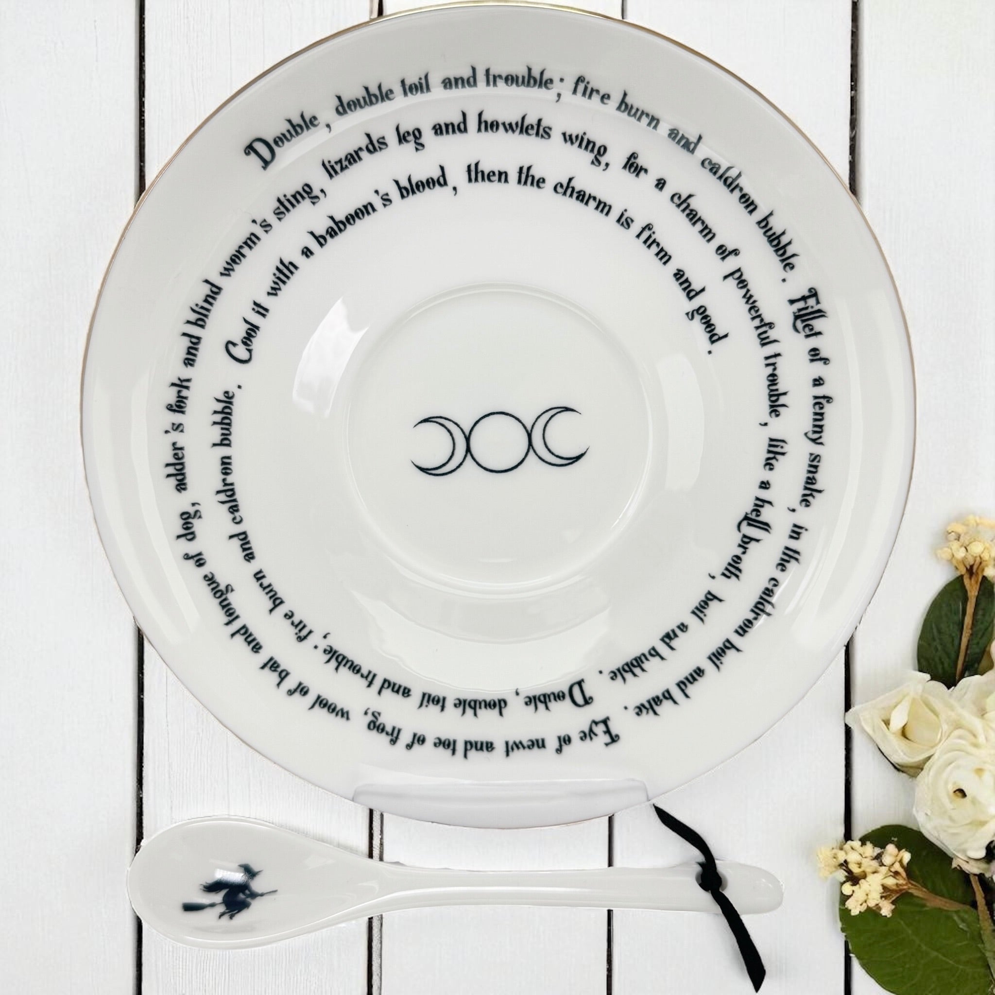 Styled image of the Witches Brew saucer being used for symbolic divination with tea leaves.