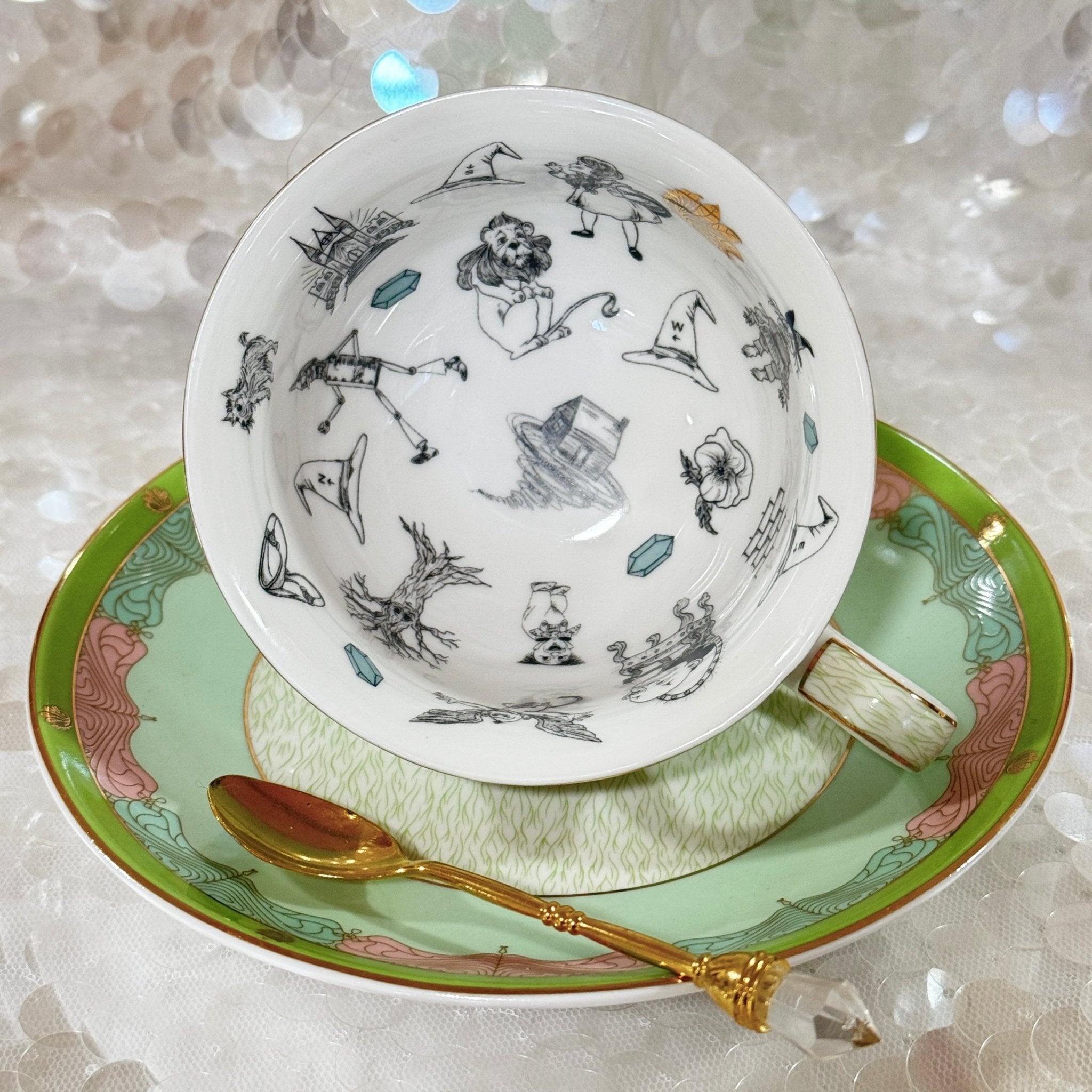 Wizard of Oz fortune telling tea cup and saucer. Inside symbols rich in symbology. 