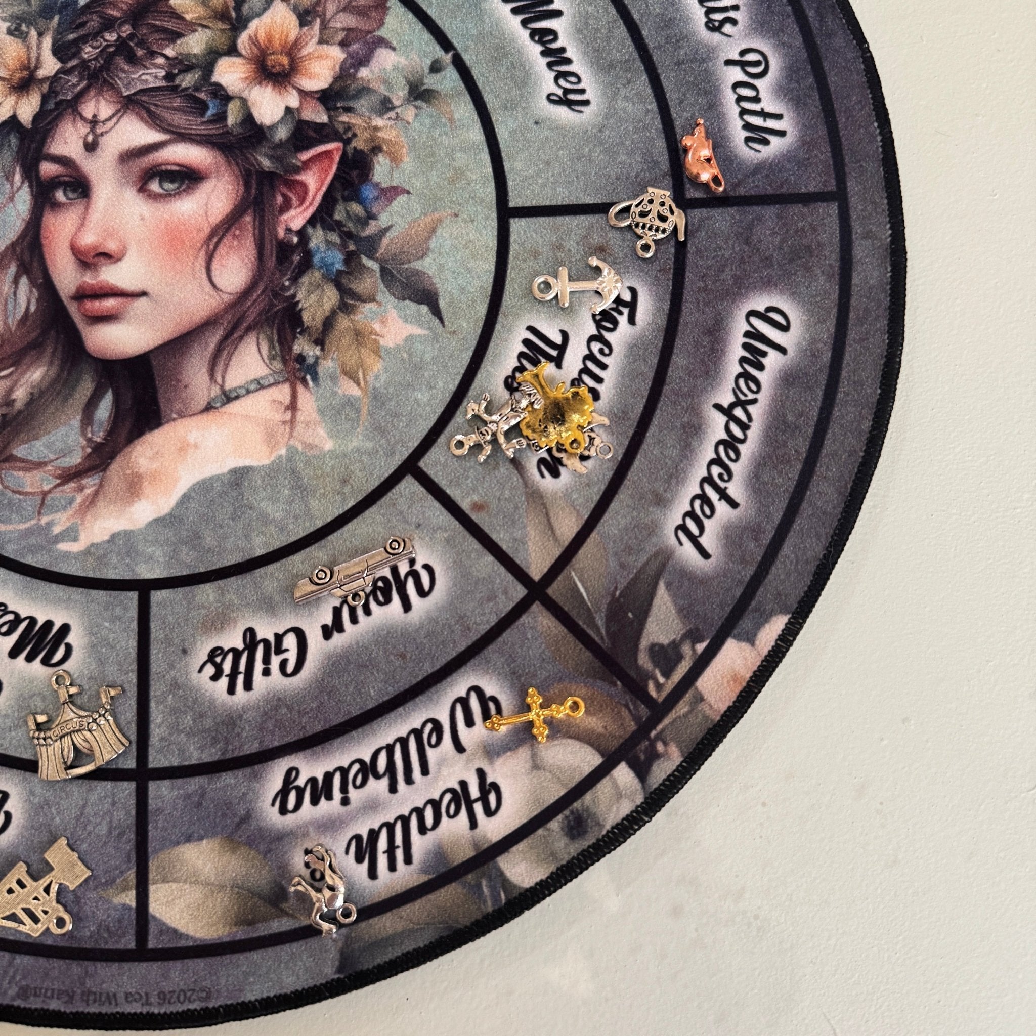 Circular design with a woman's face and various symbols and text on a light gray background