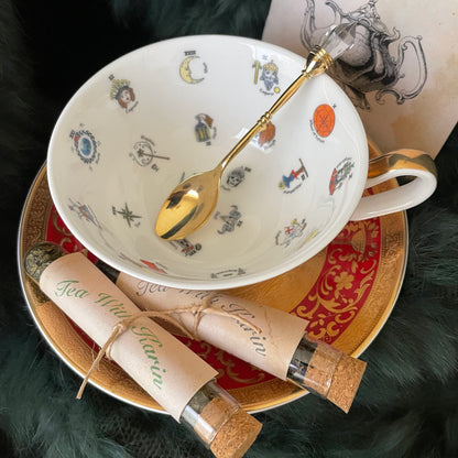 This is a fortune teller teacup that is used just like you would tarot cards to forecast your future. Learn tea leaf reading as you just use the booklet provided and read what image the tea lands on. Embossed 3D 24kt real gold