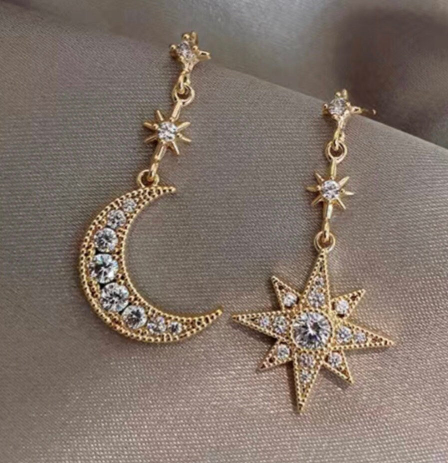 Free moon and stars earrings with this teacup.