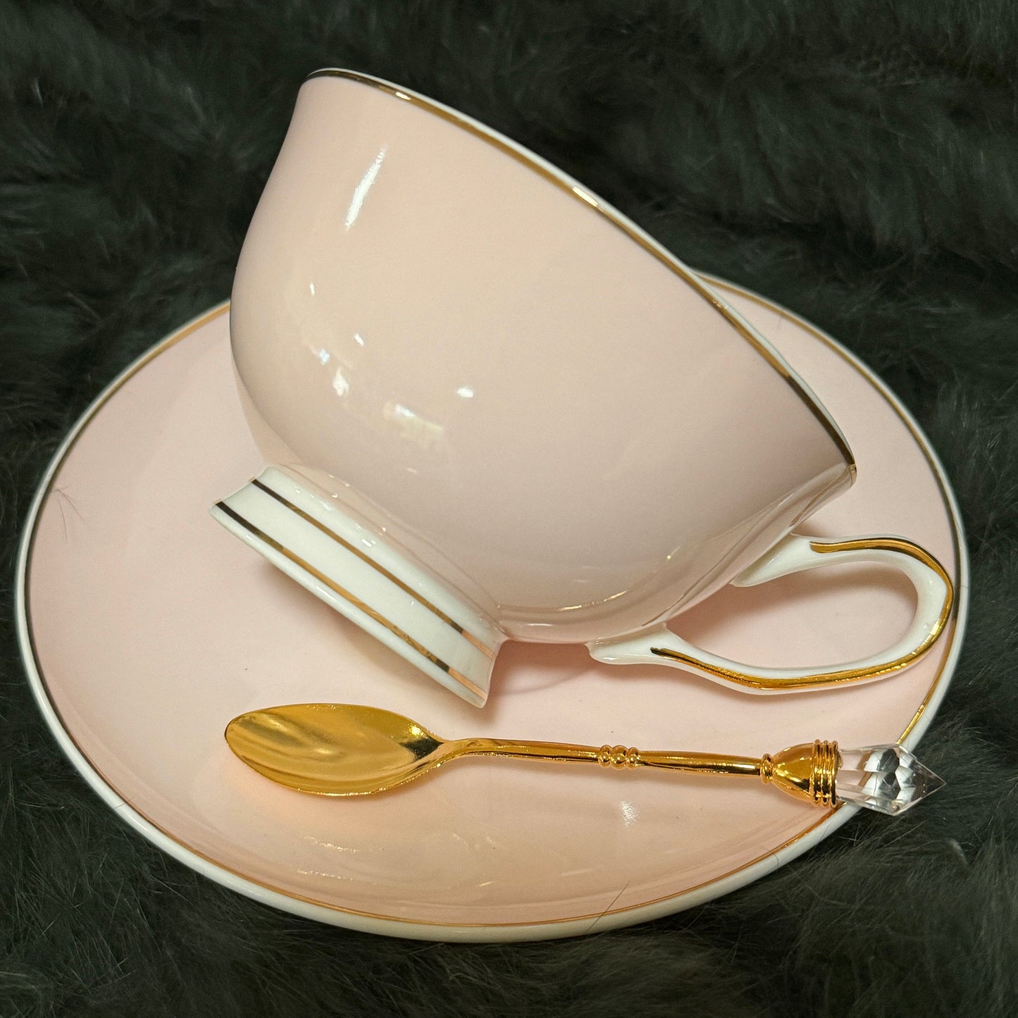 This is a pale pin k teacup and saucer set. It is a lovely pale pink colour and has 32 tea leaf reading images permanently fired inside the teacup. Remove the guess work out of tea leaf reading. Perfect gift for Mom, friend or loved one.