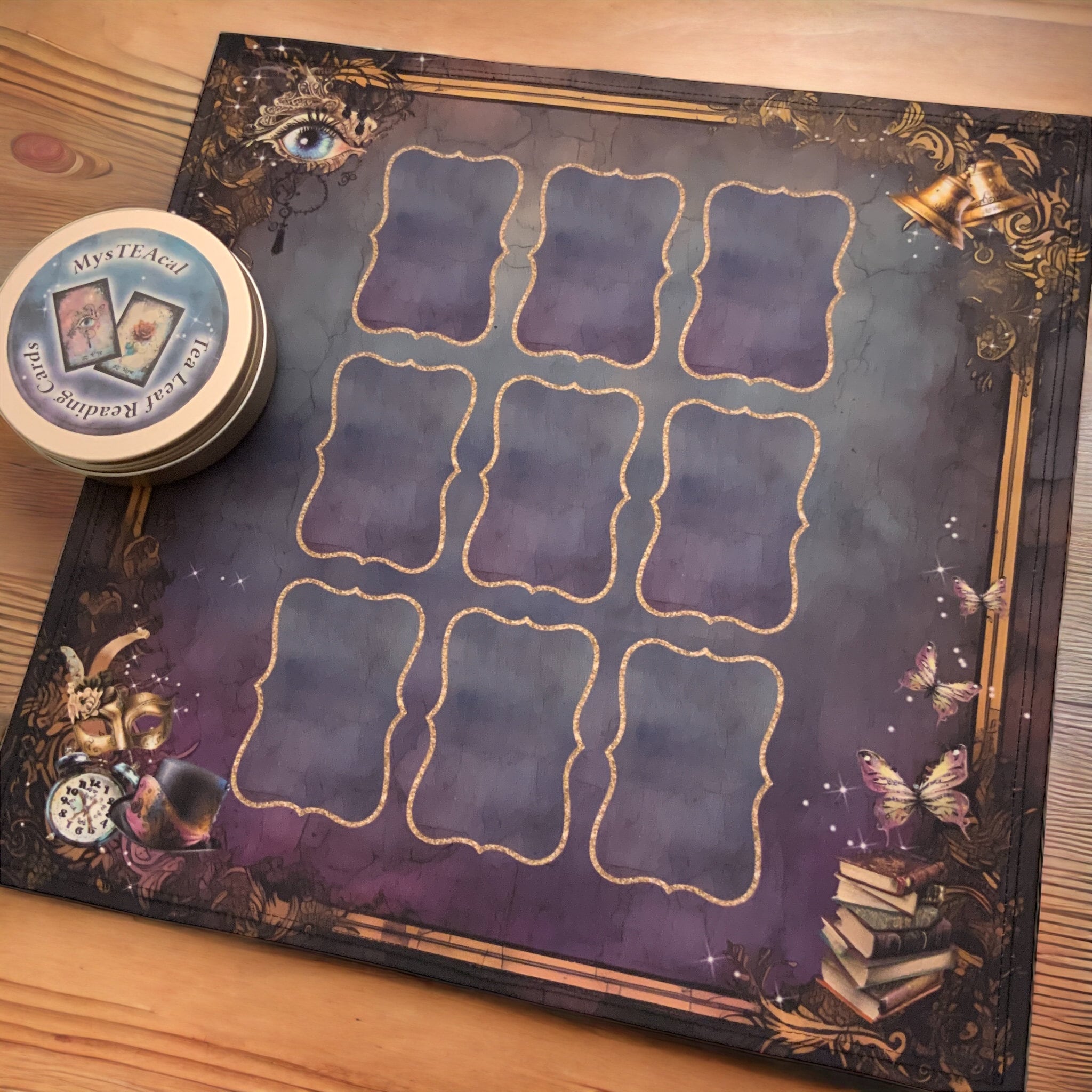 Tea leaf reading card deck with 45 high-gloss, 300gsm cards featuring unique symbols, a symbol dictionary, and a gold teaspoon, presented in a cotton drawstring bag