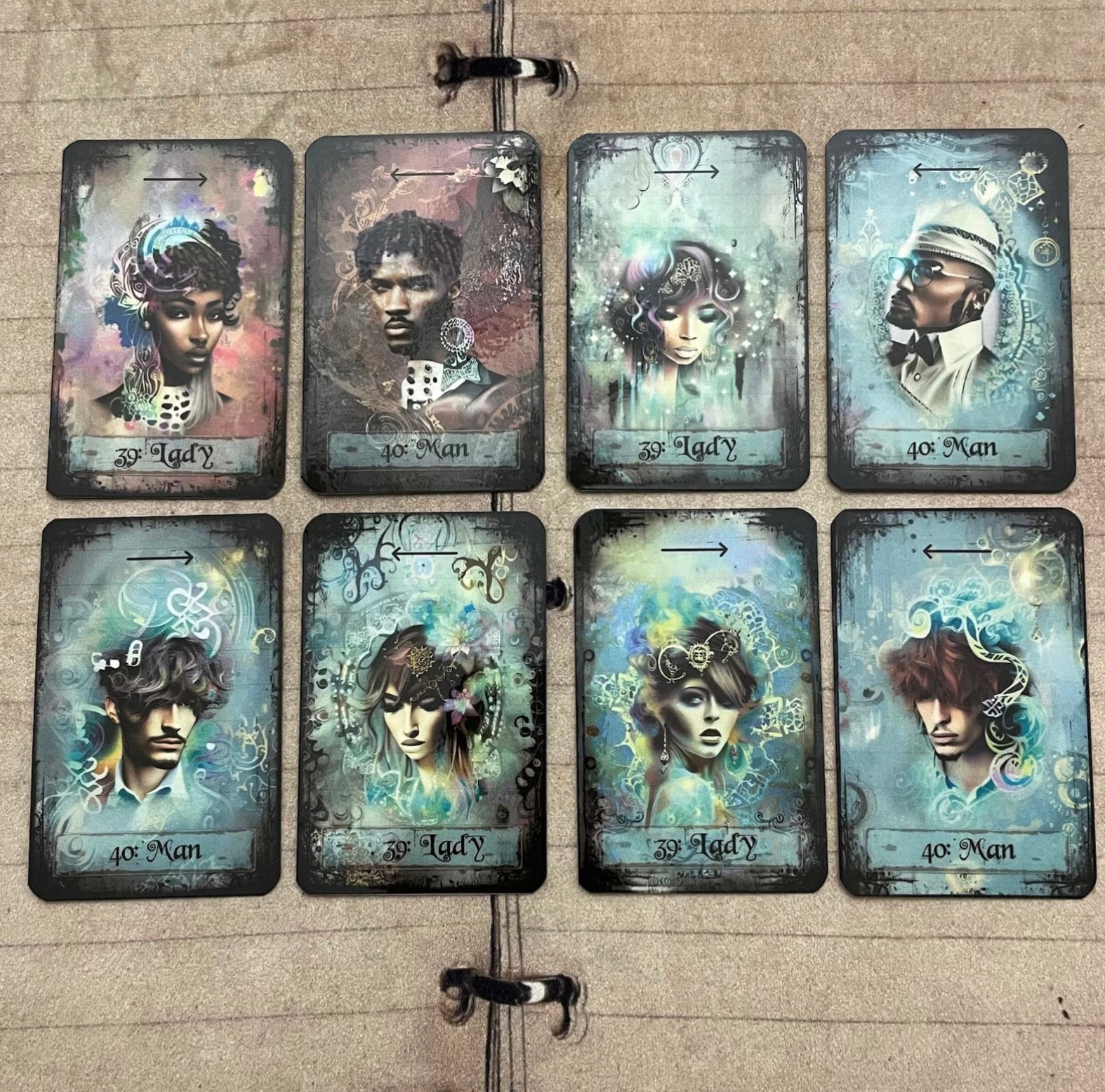 Tea leaf reading card deck with 45 high-gloss, 300gsm cards featuring unique symbols, a symbol dictionary, and a gold teaspoon, presented in a cotton drawstring bag