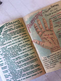 Vintage Fortune Telling Booklet open showing tasseography symbol meanings